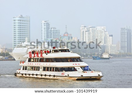 SHANGHAI-NOV. 20, 2010. Cruise boat on Nov. 20, 2010 in Shanghai. Shanghai wants to develop tourism into a strategic industry, create 300,000 jobs, contribute 8.5 percent to the city\'s GDP by 2015.