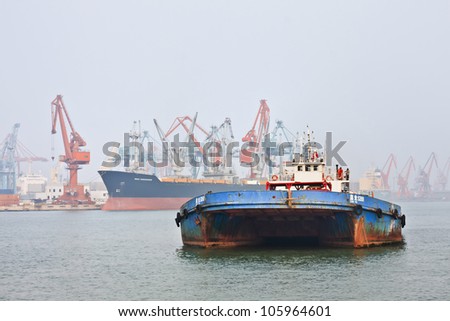 TIANJIN-OCT. 13:Rusty boat in Port of Tianjin on Oct. 13, 2008. The Largest port in North China, main gateway to Beijing. In 2011 it handled 450 million tons cargo, 11.5 million TEU containers.