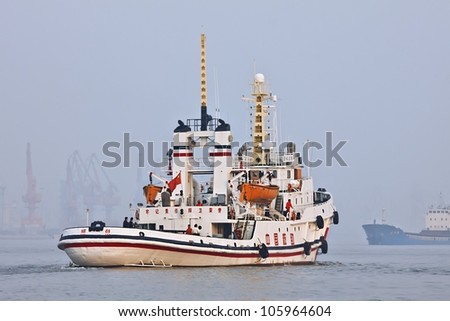 TIANJIN-OCT. 13:Tug boat in Port of Tianjin on Oct. 13, 2008. The largest port in North China, main gateway to Beijing. In 2011 handled 450 million tons cargo, 11.5 million TEU containers.