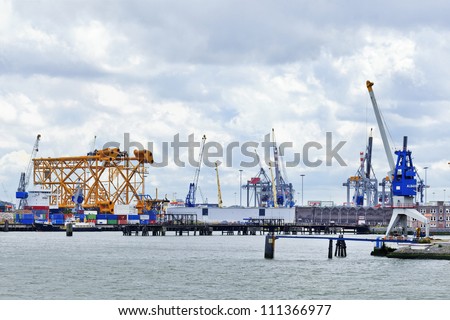 ROTTERDAM-AUG. 7: Cranes and equipment on Aug. 7, 2012 in Port of Rotterdam. Port of Rotterdam Netherlands is the largest port in Europe Covering 105 sq. KM, stretches over a distance of 40 KM.