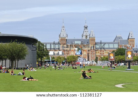 AMSTERDAM-AUG. 17, 2012. Museum square on Aug. 17, 2012 in Amsterdam. Several museums are located around the very touristy square: Rijksmuseum, Van Gogh Museum, Stedelijk Museum and Diamond Museum.