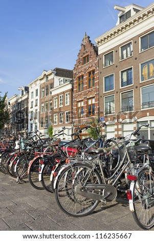 AMSTERDAM-AUG. 20, 2012. Parked bicycles on Aug. 20, 2012 in Amsterdam. Bicycles outnumber people in Amsterdam: 760,000 citizens, nearly a million bikes. There are also twice as many bikes then cars.