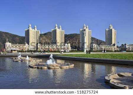 DALIAN-NOV. 9, 2012. Apartment buildings Dalian Xinghai Square on Nov. 9, 2012. City square located to north of Xinghai Bay with total area 1.1 million m2. Its name literally means \