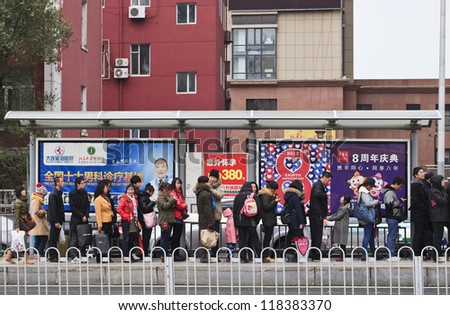 DALIAN-NOV. 11, 2012. Bus-stop with advertising on Nov. 11, 2012 in Dalian. China has 50,000 outdoor advertising companies. Outdoor advertising became third largest medium after TV and print media.