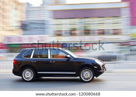 BEIJING-OCT. 28: Rushing Porsche Cayenne. Porsche may deliver more cars in China than in its German home market by 2011, according the Jebsen Group, Porsche dealer on Oct. 28, 2011 in Beijing.