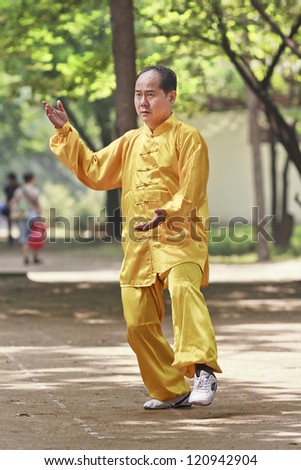 XIAN-MAY 21. Chinese man practice Tai Chi. Tai Chi Chuan means \'Supreme Ultimate Fist\' and is a popular martial art in China practiced for self defense and health benefits. Xian, May 21, 2009.