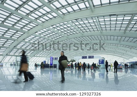 BEIJING-FEB. 21. Passengers at railway station, Beijing Capital Airport Terminal 3. The world\'s largest airport terminal-building complex measures 986,000 m2 floor surface. Beijing, Feb. 21, 2013.
