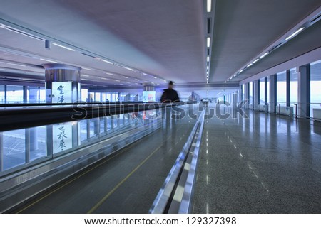 BEIJING-FEB. 21. Corridor with moving walkway, Beijing Capital Airport Terminal 3. The world\'s largest airport terminal has 243 elevators, escalators or moving walkways. Beijing, Febr. 21, 2013.