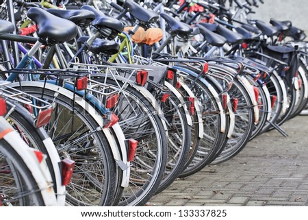 Row parked bicycles in Amsterdam