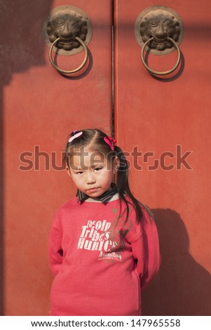 BEIJING-JAN. 28. Nine years old Li Wang Jing in front of her home. China\'s one-child policy was introduced in 1979, it restricts couples in urban areas to have only one child. Beijing, Jan. 28, 2009.