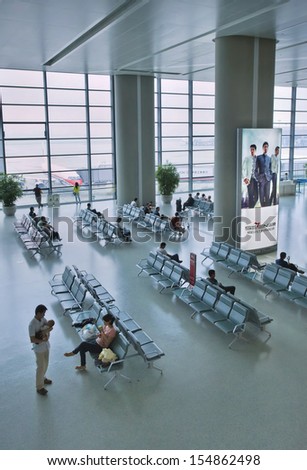 SHANGHAI, JUNE 11. Passengers in the waiting area of Shanghai Hongqiao International Airport, the main domestic airport serving Shanghai, with limited international flights. Shanghai, June 11, 2013.