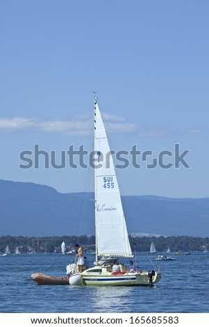 GENEVA-JULY 25. Recreational sailing on Lake Geneva. A style of casual coastal cruising called gunk-holing is a popular summertime family recreational activity at Lake Geneva. Geneva, July 25, 2011.