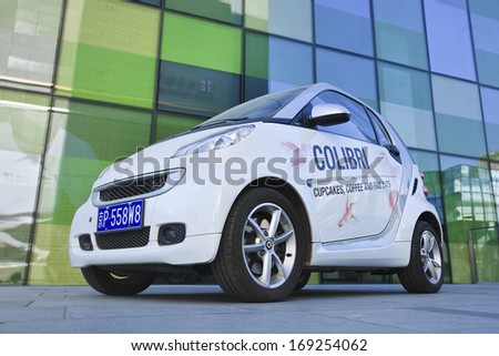 BEIJING-DEC. 12, 2013 Smart Car with advertising. Smart Car sales in China grew 45% in 2012 to 15,680 cars. Given the size of China\'s automobile market, it\'s still a niche player. Beijing, Dec. 12, 2013
