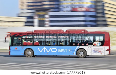 CHANGCHUN, CHINA-JAN. 31, 2014. Bus on the road. Cheapest way to travel around Changchun is by city bus which is centered around many bus routes, it cost 1 RMB to take bus no matter where ever you get off.