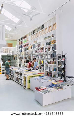 BEIJING-JULY 21, 2007. Book store interior at Dashanzi art area. Dashanzi is a famous art zone with over 200 galleries housed in characteristic fifties Bauhaus style former factory buildings.