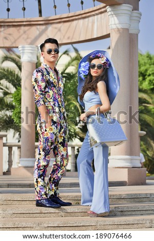 HENGDIAN-CHINA-APRIL 14, 2014. Outdoor fashion shoot with Chinese models. China is expected to become largest fashion market within five years, forecast by McKinsey to soar to US$27 billion by 2015.