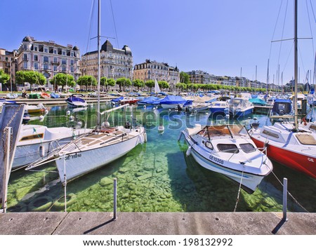 GENEVA-JULY 25, 2011. Luxurious yachts anchored at Lake Geneva. The cost of living in Switzerland is among the highest in the world, with Zurich and Geneva ranked second and third most expensive.
