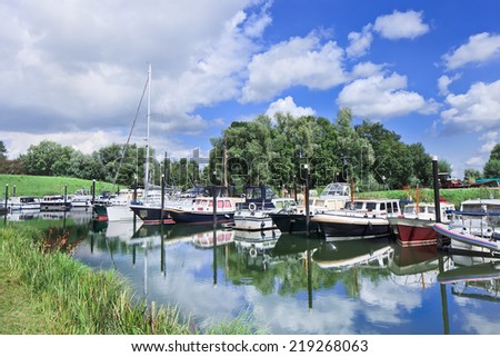 Small harbor with yachts located in a green environment, Woudrichem, The Netherlands