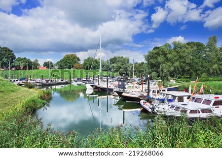 Tranquil harbor with yachts located in a green environment, Woudrichem, The Netherlands