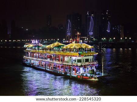 CHONGQING-NOVEMBER. 4, 2014. Tour boat on Yangtze river. Chongqing offers a variety of affordable boat tours on the Yangtze rivers which flows trough the city with romantic illuminated vessels.