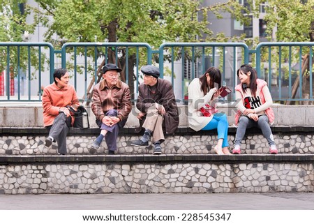 CHONGQING-NOVEMBER 4, 2014. Chinese elderly and youngsters. Government report forecasts China becomes the world's most aged society in 2030, by 2050 its older population will swell to 330 million.