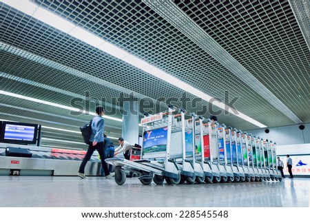 BEIJING-MAY 6, 2014. Baggage claim Beijing Capital Airport. It is the second busiest airport in the world in terms of passenger throughput behind US Hartsfield-Jackson Atlanta International Airport.