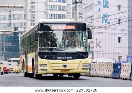 CHONGQING-NOV. 4, 2014. Public transport. Most popular transport mode is public bus. Start price is CNY 1 for common buses and CNY 1.5 for air-conditioned buses. Running hour buses is 5:30 to 21:00.