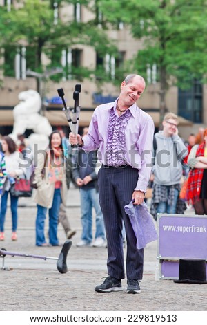 AMSTERDAM-AUGUST 26, 2014. Superfrank the street performer. Amsterdam offers every summer plenty low-cost entertainment, special performances, festivals, cultural events and street performers.