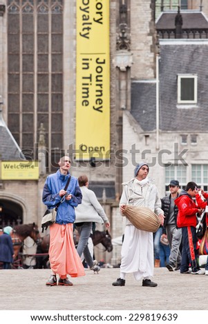 AMSTERDAM-AUGUST 26, 2014. Hare Krishnas at the Dam Square. Hare Krishna is a religious movement based on traditional Hindu scriptures, it is founded in 1965 by Bhaktivedanta Swami Prabhupada.