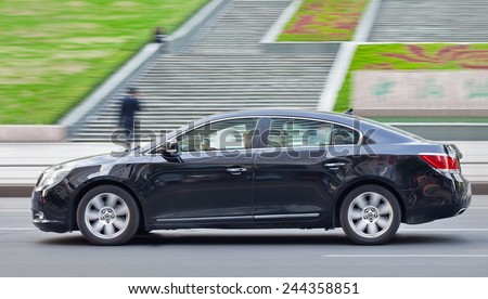 WENZHOU-CHINA-NOV. 19, 2014. Buick Lacrosse downtown. China is Buick\'s biggest market and GM does considerable design and development there, including on models intended for both China and the U.S.