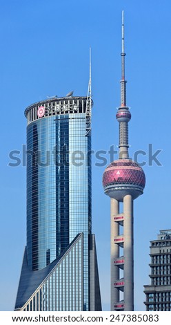 SHANGHAI-DEC. 2, 2014. Oriental Pearl Tower near China Bank tower. With 470 meter Oriental Pearl is one of Shanghai\'s tallest buildings, located at Lujiazui in Pudong district, side of Huangpu River.