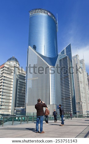 SHANGHAI-DEC. 2, 2014. Man photographing Lujiazui, a national-level development zone designated by government. In 2005, State Council reaffirmed positioning of Lujiazui area as finance and trade zone.