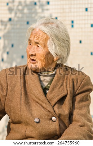 BEIJING NOV. 30, 2006. Old Chinese lady with white hair. China\'s current elderly population (60 years or older) is about 128 million, means one in every ten people, makes it the largest in the world.