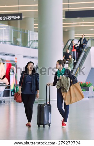 SHANGHAI-MAY 6, 2014. Passengers in departure area of Hongqiao Airport. It is Shanghai's main domestic airport, 13 KM west of downtown, closer to city center than Pudong, main international airport.