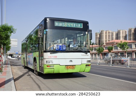 BEIJING-MAY 7, 2015. Public bus stop in Beijing. Public bus service in Beijing is among the most extensive, widely used and affordable form of public transportation in urban and suburban districts.