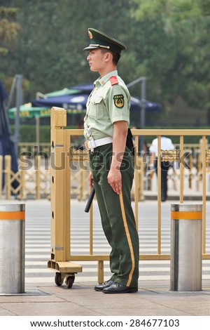 BEIJING-JUNE 1, 2015. Honor guard at a gate on Tiananmen. Honor guards are provided by the People\'s Liberation Army at Tiananmen Square for flag-raising ceremony and presence on Tiananmen Square.