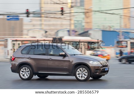 BEIJING-DEC. 12, 2013. BMW X 5. BMW\'s China sales have been outstanding last year. Growth in its wholesale volumes surged nearly 18% in first nine months of 2014, compared with same period in 2013.