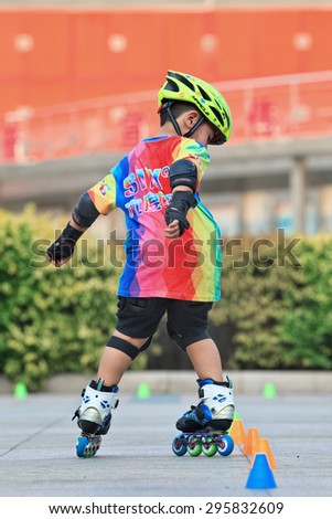 BEIJING-JULY 10, 2015. Boy practicing inline skating. Although Ping-Pong, basketball and badminton are China\'s top sports, last decade inline skating became increasingly popular among Chinese youth.