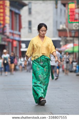 BEIJING-JUNE 9, 2015. Traditional dressed woman. Lives of Chinese women have significantly changed since rise of the People\'s Republic of China, which publicly committed itself to gender equality.