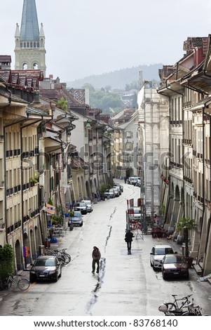 BERN, SWITZERLAND - JUNE 24. The historic center of Bern on June 24, 2011. Since 1983, the historic center of Bern, with its six kilometers of arcades, has been listed by UNESCO as World Cultural Heritage.