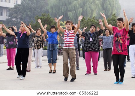 ZHAOJIAKOU, CHINA - SEPT. 4, 2011. Morning group exercise on Sept. 4, 2011. Mass exercise make come back in China. Netizens call the move a return to the practices of the Cultural Revolution.
