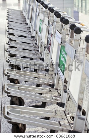 BEIJING - OCT.13. Lined up baggage trolleys at Beijing Capital Airport. It has registered 488,495 aircraft movements (take-offs and landings), ranked 10th in the world. Beijing, Oct. 13, 2011.