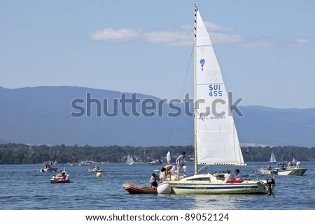 GENEVA - JULY 25. Casual sailing on Lake Geneva. A style of casual coastal cruising called gunkholing is a popular summertime family recreational activity at Lake Geneva. Geneva, July 25, 2011.