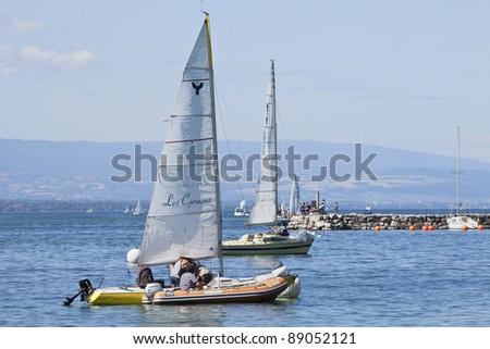 GENEVA - JULY 25. Casual sailing on Lake Geneva. A style of casual coastal cruising called gunkholing is a popular summertime family recreational activity at Lake Geneva. Geneva, July 25, 2011.