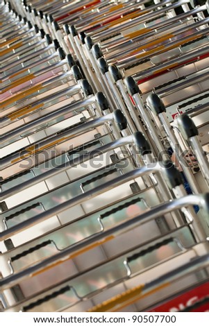 BEIJING - DEC 9: Lined up baggage trolleys at Beijing Capital Airport on Dec 9, 2011.  The airport has registered 488,495 aircraft movements (take-offs and landings).
