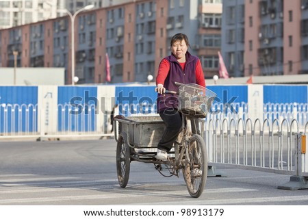 BEIJING-MARCH 27, 2012. Woman migrant worker on March 27, 2012 in Beijing. The female Labor force (% of total labor force) in China was 44.60 in 2009, according to World Bank report published in 2010.