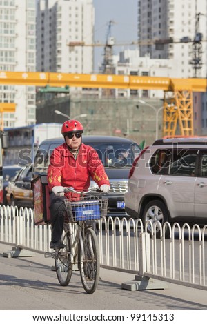 BEIJING-MARCH 27, 2012. Fast food courier on March 27, 2012 in Beijing. China\'s breathless expanded chain restaurants compete to grab a bigger slice of its annual 200 billion Yuan fast-food market.