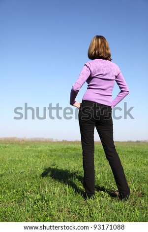 Woman\'s future Close up of the girl looking at a green meadow.