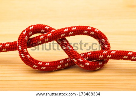 eight rope knot on wooden table