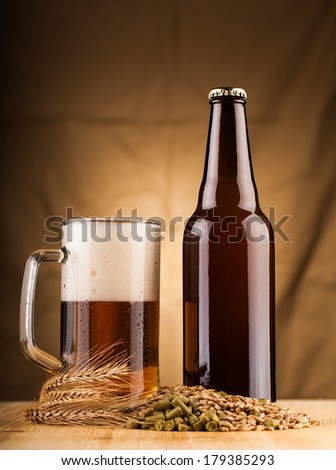 glass and bottle of home made  beer on table